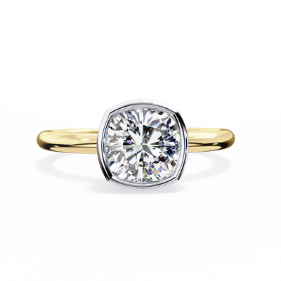 Gold ring with a large diamond on a white background