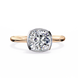 Rose gold ring with a large diamond on a white background