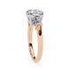 Rose gold ring with a diamond on a white background