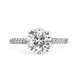 Diamond ring with a large central gemstone and smaller stones on the band against a white background