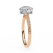 Rose gold ring with a diamond on a white background