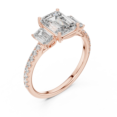 emerald diamond three-stone pavé ring in rose gold
