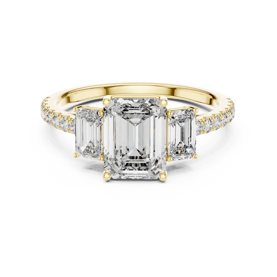 emerald diamond three-stone pavé ring in yellow gold
