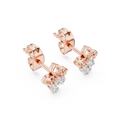 Side profile of rose gold open-petal flower cluster diamond stud earrings.