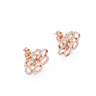 Side profile of rose gold intertwining petal diamond stud earrings.