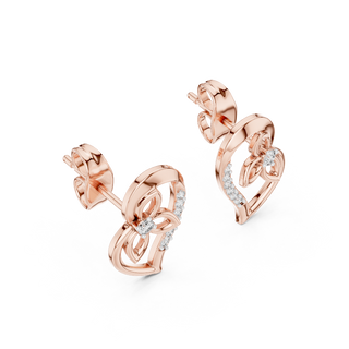Side profile of rose gold heart-shaped diamond stud earrings with floral motif.