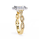 Gold ring with diamond accents on a white background