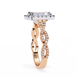 Rose gold ring with diamond accents on a white background