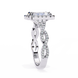 Silver ring with diamond accents on a white background