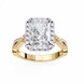 Gold ring with a large diamond and smaller diamonds on the band against a white background