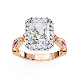 Rose gold ring with a large diamond and smaller diamonds on the band against a white background