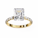 Gold ring with a large diamond and smaller diamonds on the band against a white background