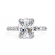 Diamond ring with a large central gemstone and smaller stones on the band against a white background