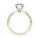 Gold ring with a diamond on a white background