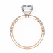 Rose gold ring with a diamond on a white background
