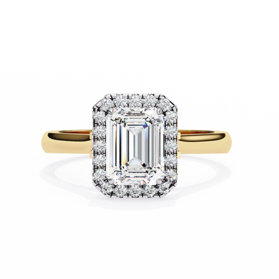 Diamond ring with yellow gold band on a white background