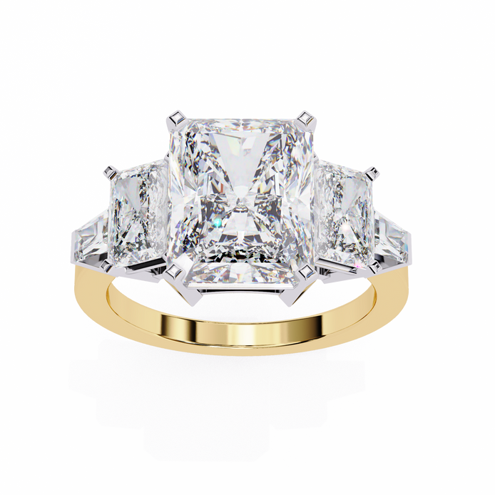 Gold ring with three large diamonds on a white background