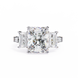 Diamond ring with two side stones on a white background