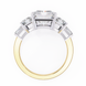 Gold and silver ring with diamond accents on a white background