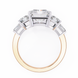 Gold ring with diamond accents on a white background