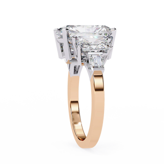 Rose gold ring with a large diamond on a white background