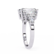 Diamond ring with a rectangular cut diamond on a white background