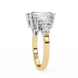 Gold ring with a large diamond on a white background