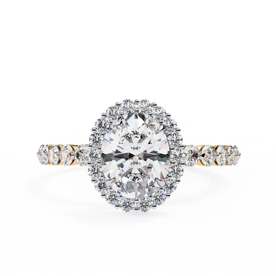 Oval cut lab grown diamond halo engagement ring in yellow gold with round diamond band