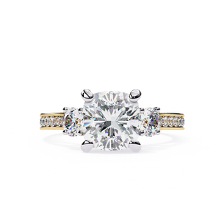 Cushion cut lab grown diamond three-stone engagement ring with pavé split shank in yellow gold