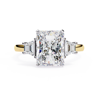Radiant cut lab grown diamond three-stone engagement ring with tapered baguette side diamonds in yellow gold