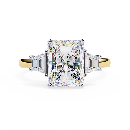 Radiant cut lab grown diamond three-stone engagement ring with tapered baguette side diamonds in yellow gold
