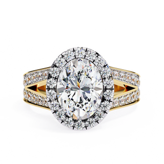 oval diamond split-shank halo ring in yellow gold
