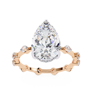 pear diamond hidden halo station ring in rose gold
