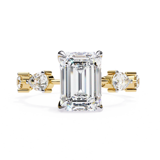 Radiant cut lab grown diamond side-stone engagement ring in yellow gold