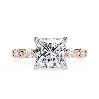 Front-facing view of a rose gold princess cut diamond ring with marquise side stones.