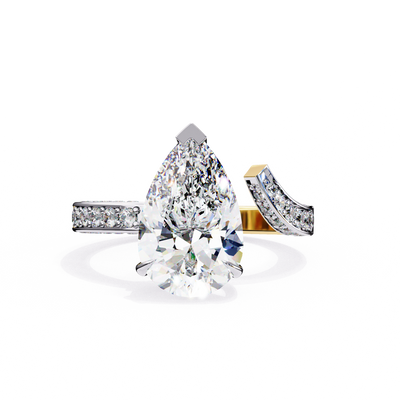 Front-facing view of a yellow gold pear diamond ring with a split shank pavé band.