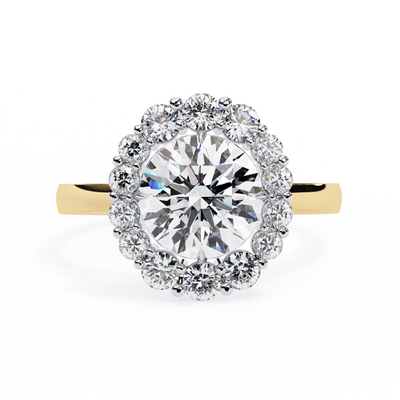 Front-facing view of a yellow gold celeste round halo diamond ring.