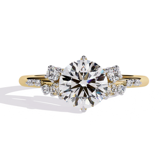 Round lab grown diamond side stone engagement ring in yellow gold