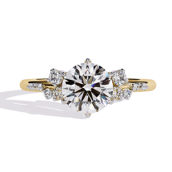 Round lab grown diamond side stone engagement ring in yellow gold