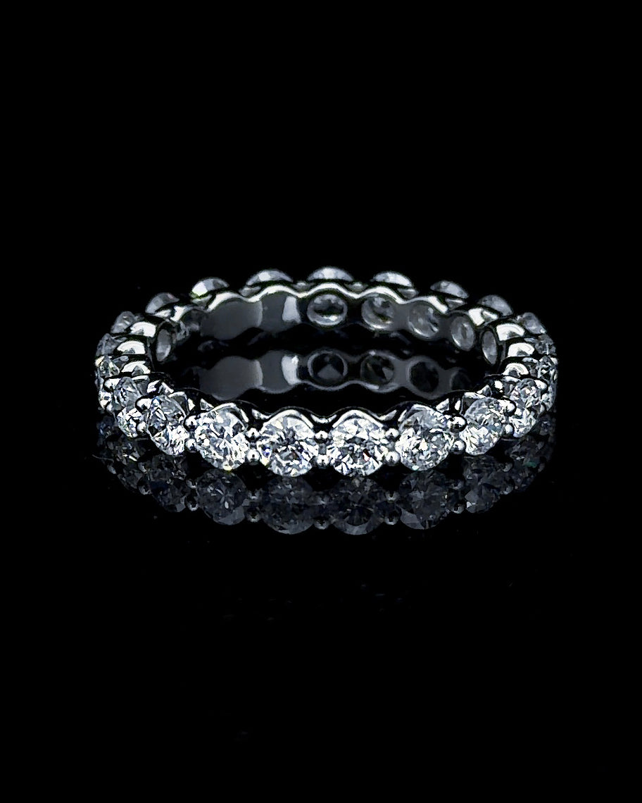 Main: White gold 4.20ct full eternity ring with 18 round lab grown diamonds on black
Detail: Close-up of round lab grown diamonds in continuous shared-prong white gold settings
Side: White gold full eternity ring with round lab grown diamonds encircling the complete band