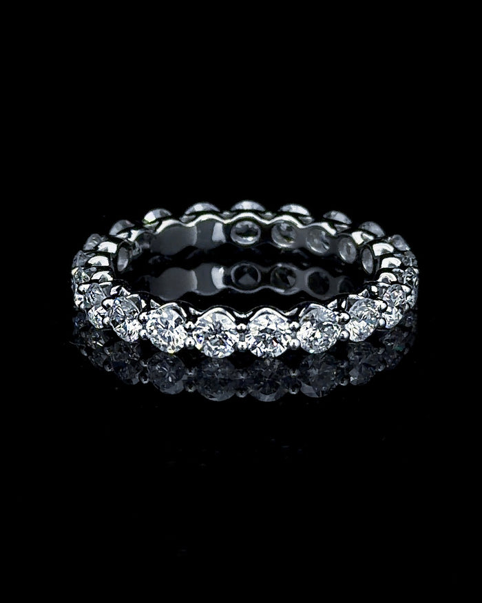 Main: White gold 4.20ct full eternity ring with 18 round lab grown diamonds on black
Detail: Close-up of round lab grown diamonds in continuous shared-prong white gold settings
Side: White gold full eternity ring with round lab grown diamonds encircling the complete band