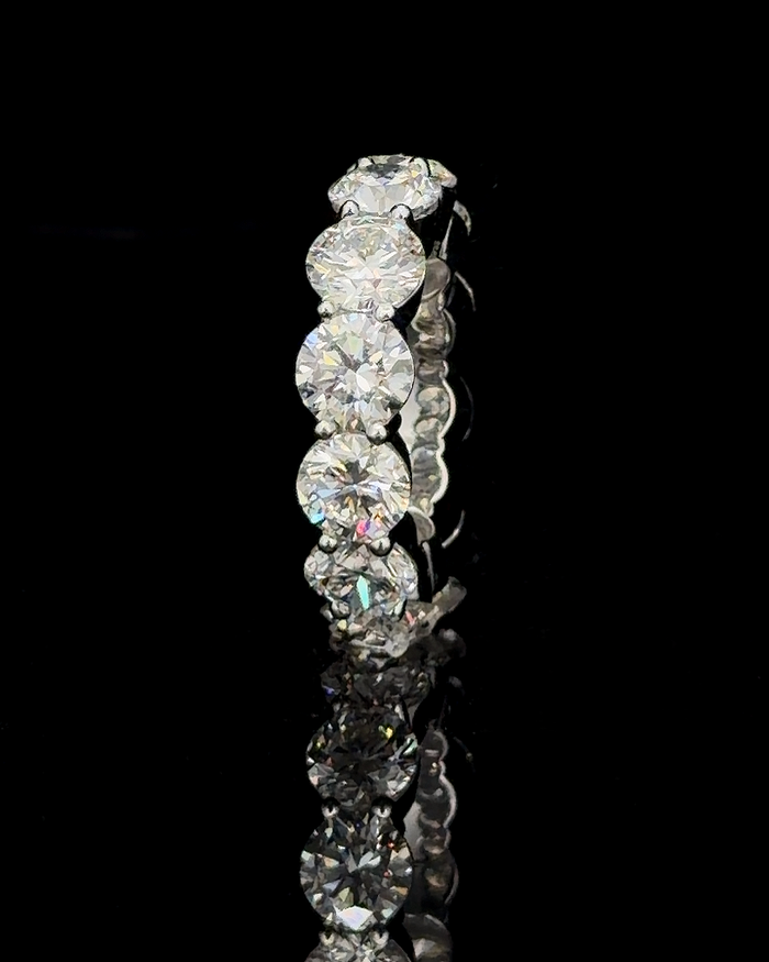 Main: White gold full eternity ring with 12 round lab grown diamonds on black
Detail: Close-up of 4.30 mm round lab grown diamonds individually prong set in white gold
Side: White gold full eternity band with 12 round lab grown diamonds circling the ring
