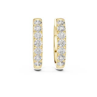 Front view of Celestial Curve diamond huggie earrings in yellow gold.