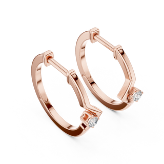 Side profile of rose gold minimal geometric chevron diamond hoop earrings.