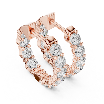 Side profile of rose gold classic round diamond hoop earrings.