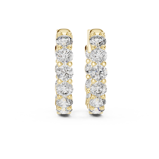 Front view of Prestige diamond inside-out hoop earrings in yellow gold.