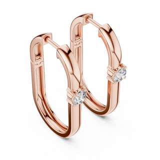 Side profile of rose gold minimal oval solitaire diamond hoop earrings.