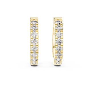 Front view of Pure Spark diamond huggie earrings in yellow gold.