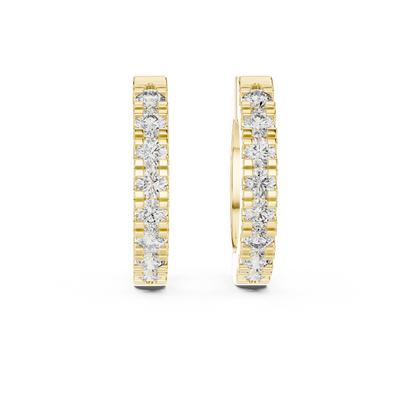 Front view of Pure Spark diamond huggie earrings in yellow gold.