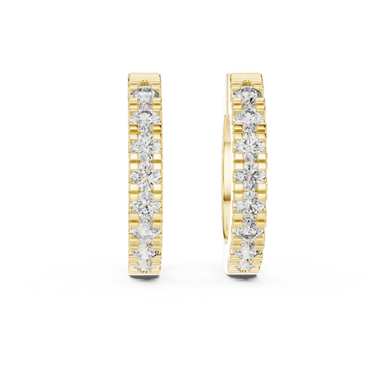 Front view of Pure Spark diamond huggie earrings in yellow gold.